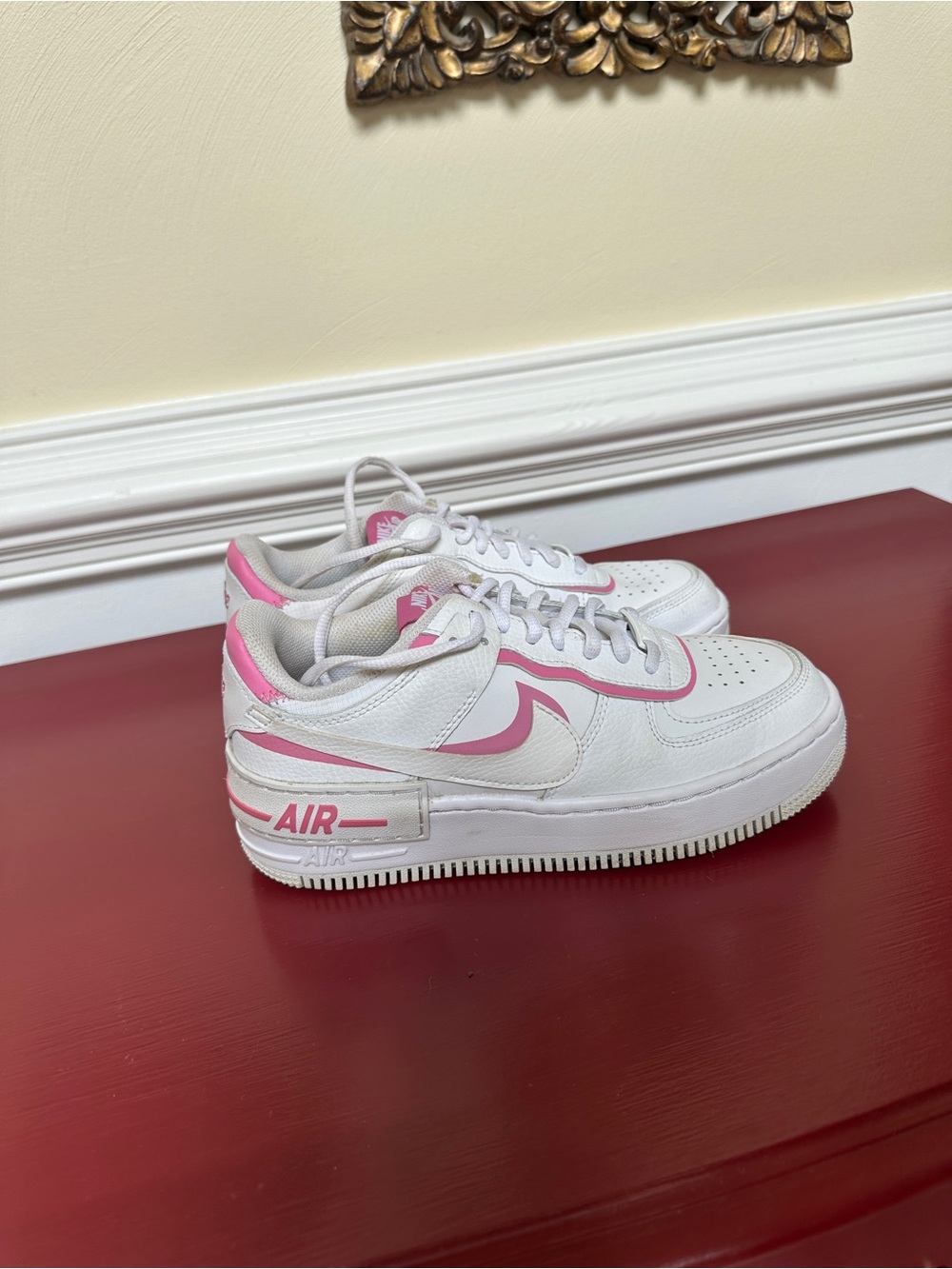 Nike White Sneakers with Pink Swoosh Accents